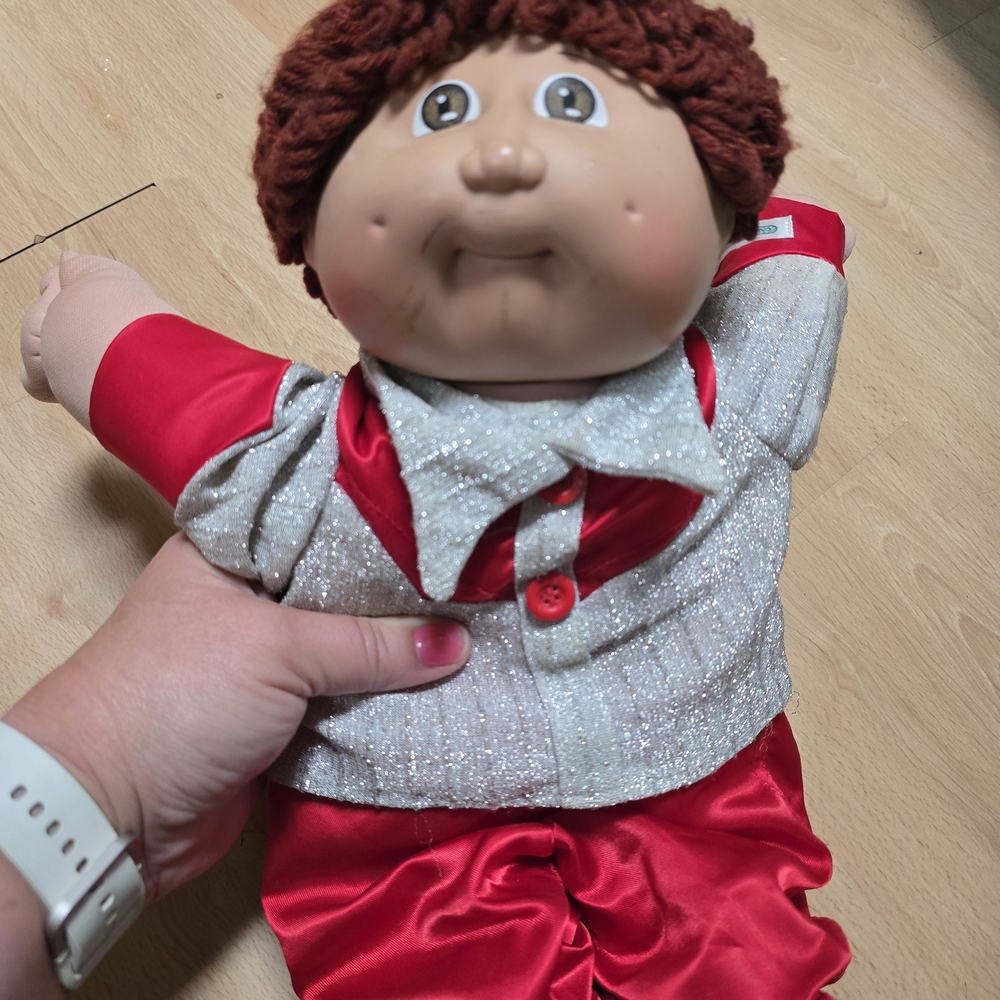 Red and Silver Kids Doll
